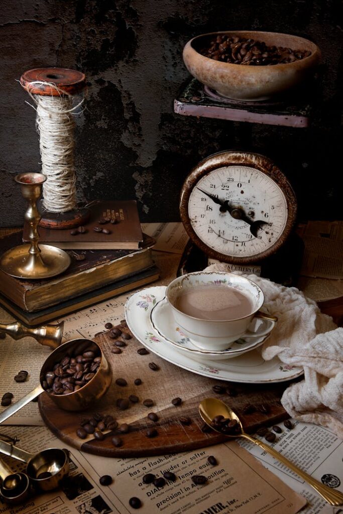 Rustic setup with coffee beans, antique scale, and vintage brass accents creating a cozy atmosphere.